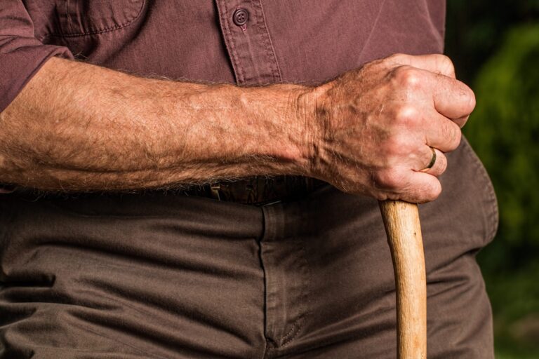 Hand resting on a cane for support, background image for where to buy Neuropathy No More safely