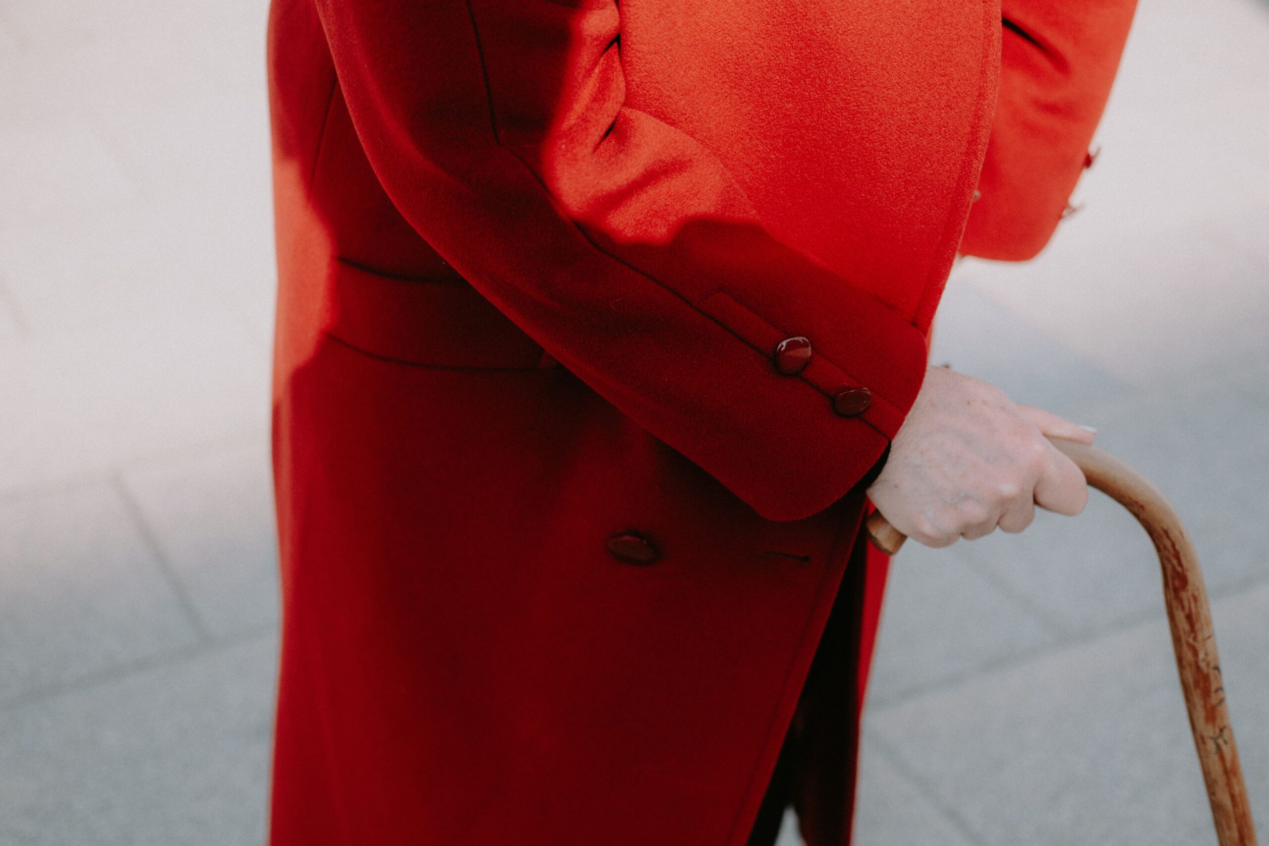 Person walking with a cane wearing a coat, background image for whether Neuropathy No More is legit